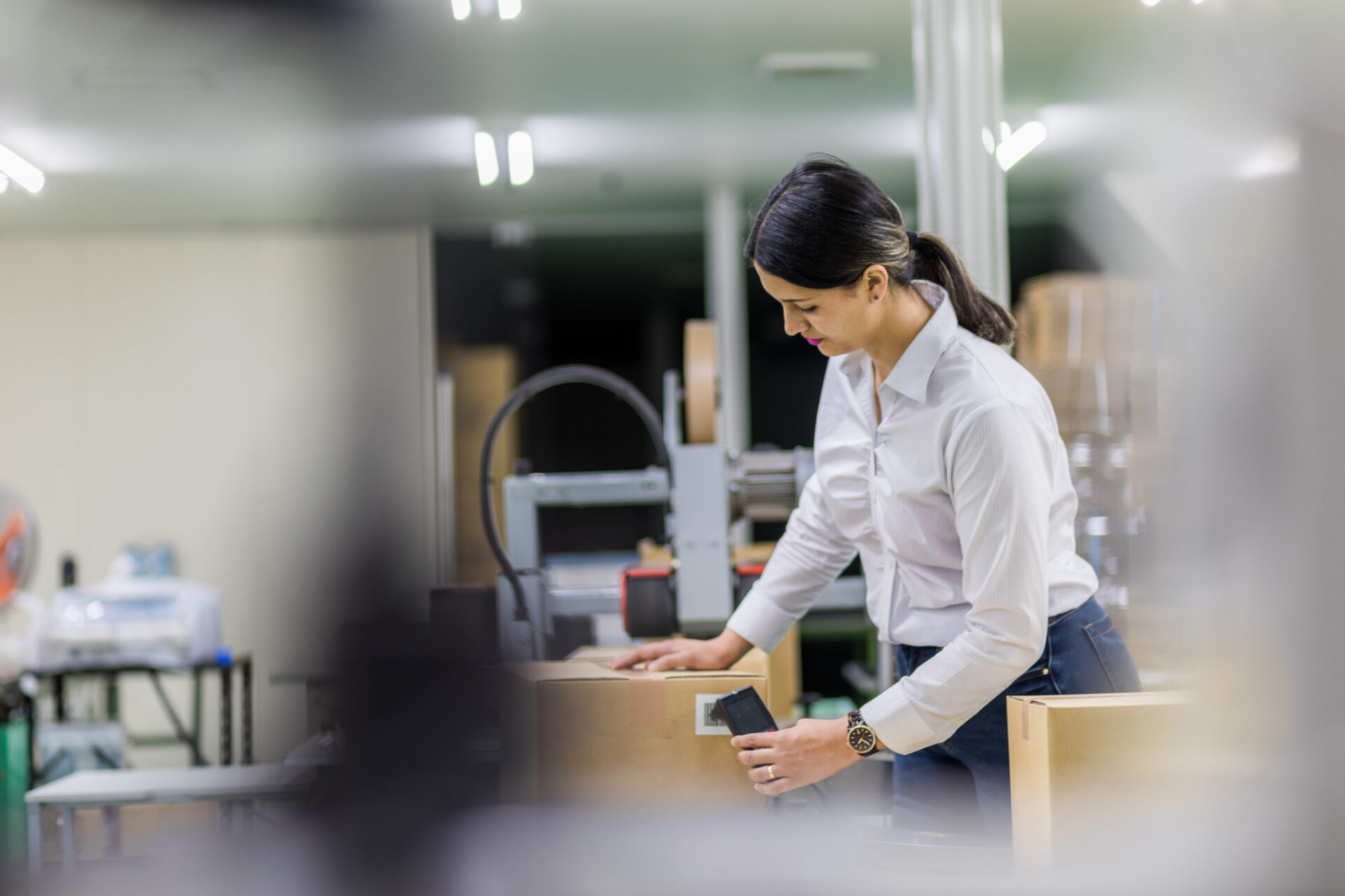 Woman using a RFID scanner in a store