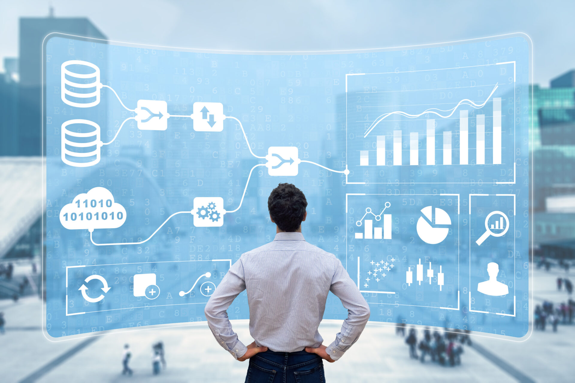 business man standing with hands on hips looking at data on a whiteboard