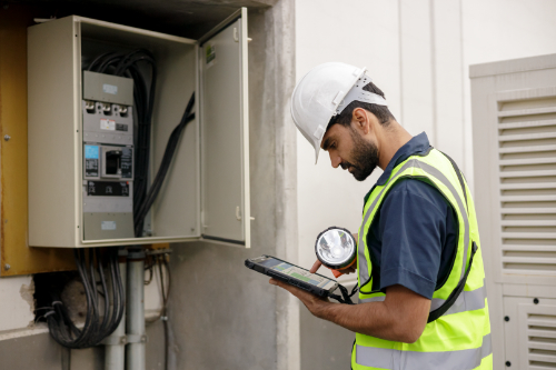 Worker using a Zebra rugged tablet in the field