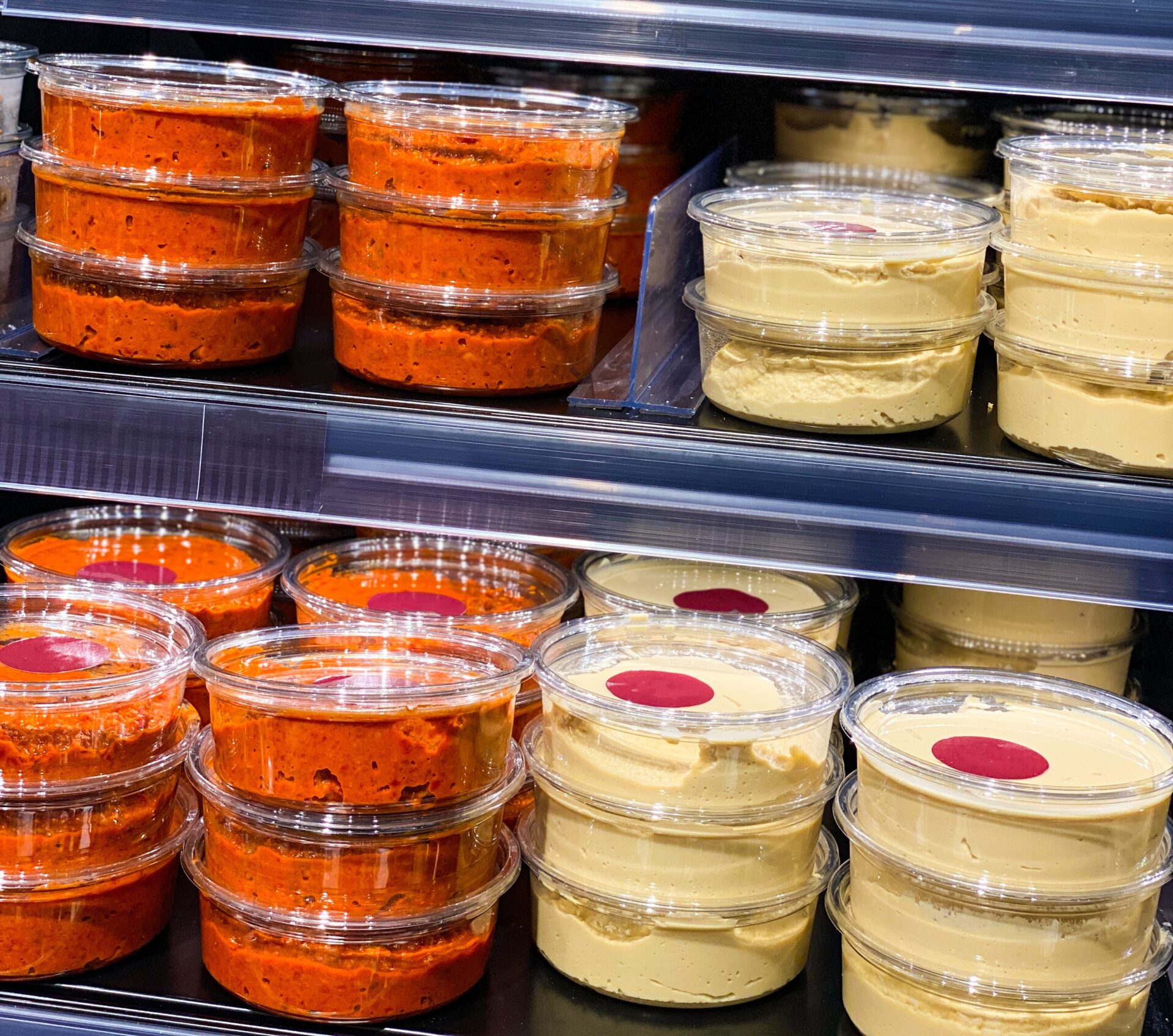 hummus on a shelf in a store