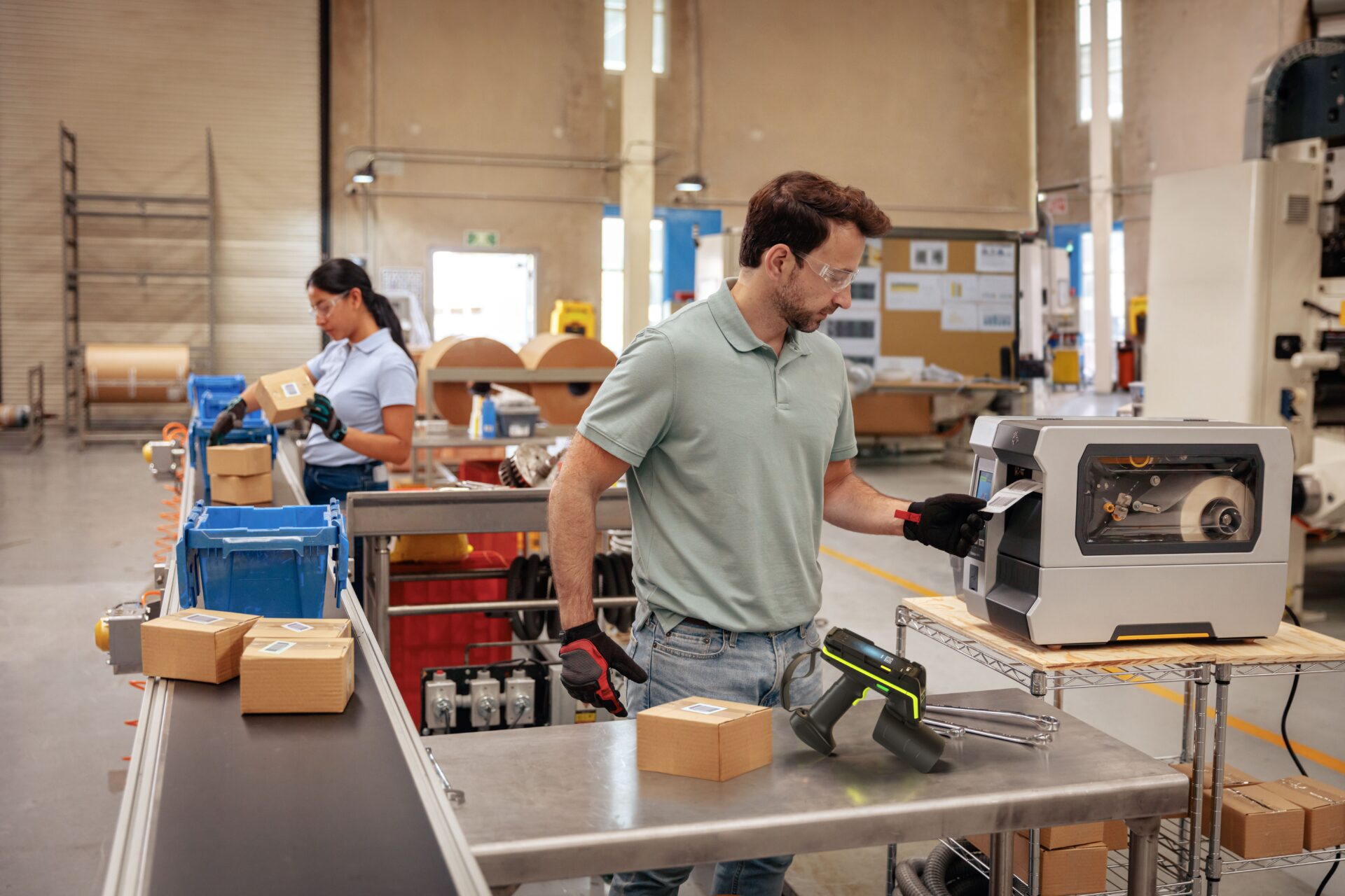 manufacturing worker scanning labels on the plant floor 