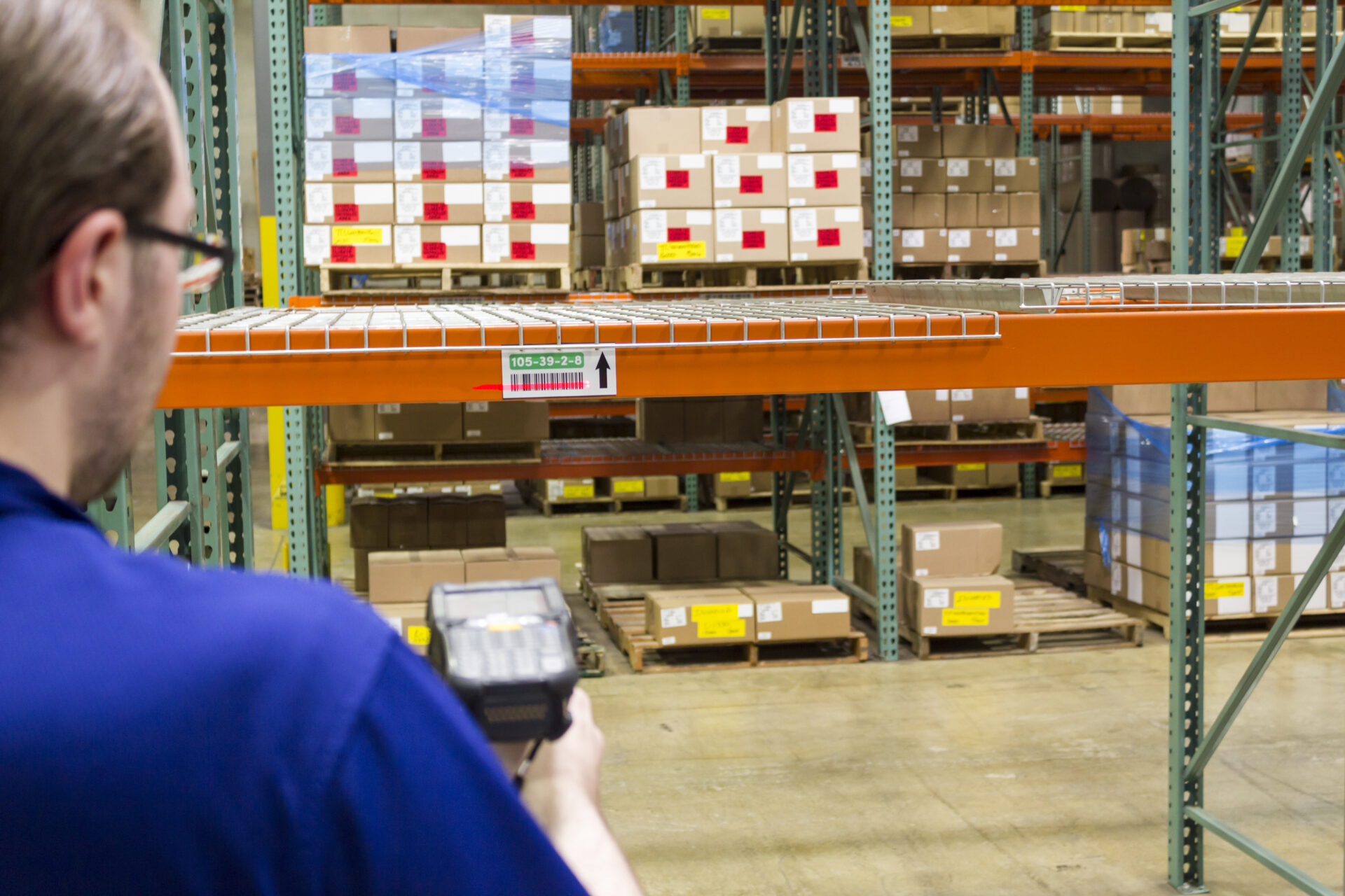 Warehuse team member using a handheld scanner