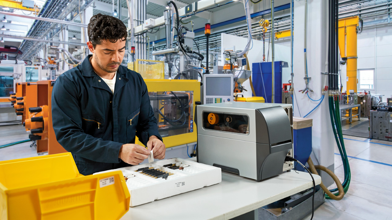Man applying labels in a warehouse