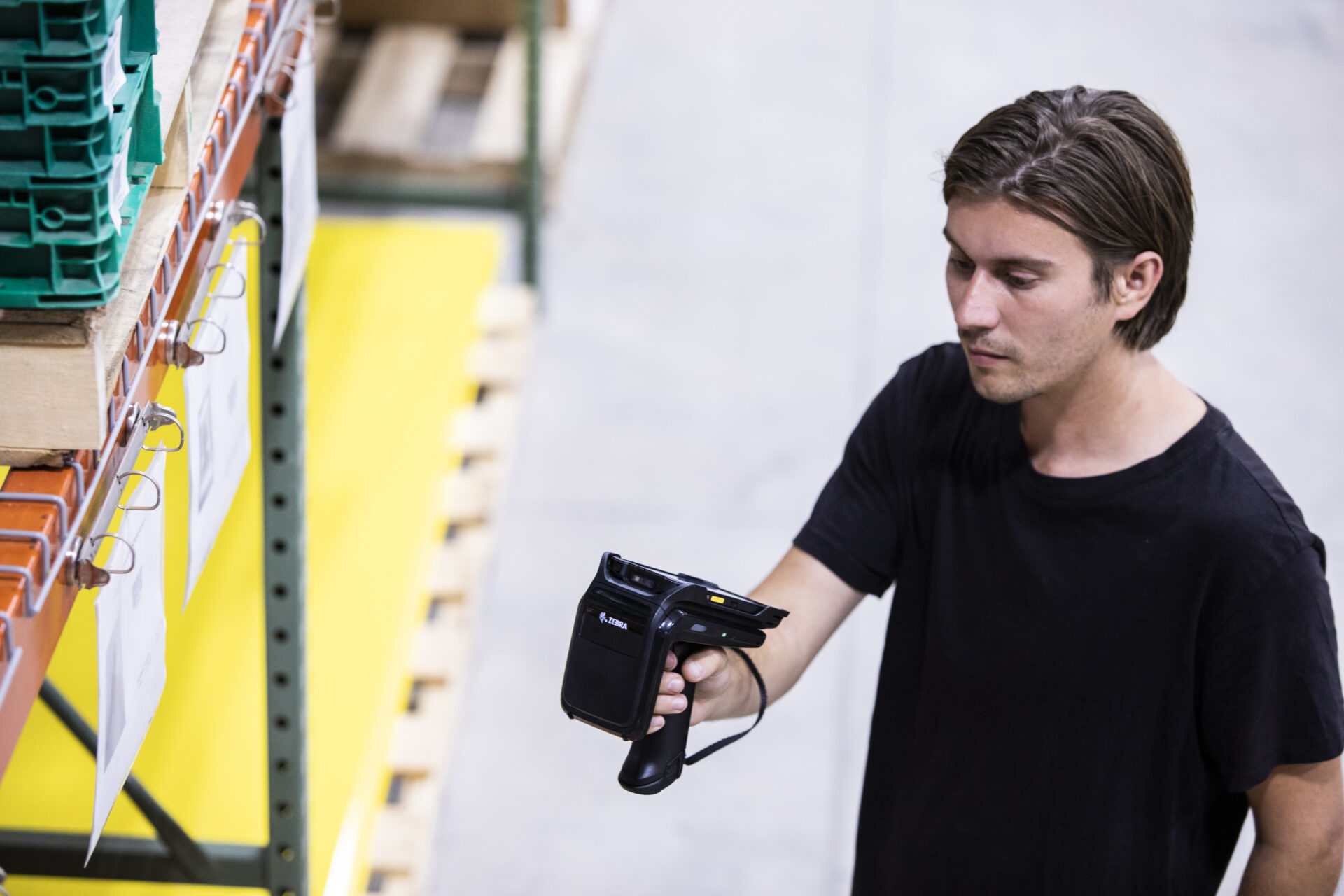 Worker using RFID scanner