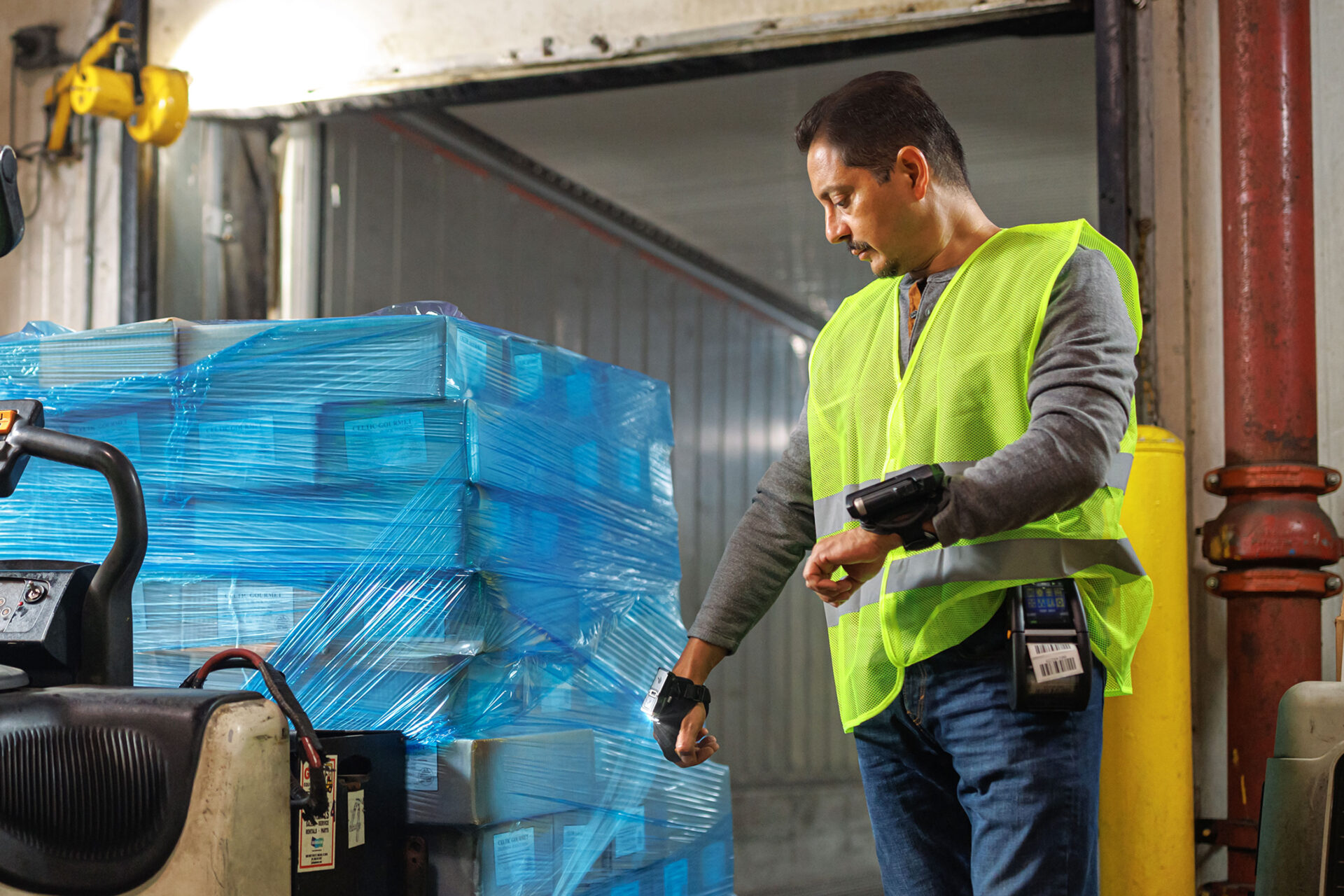 Man scanning a pallet of items