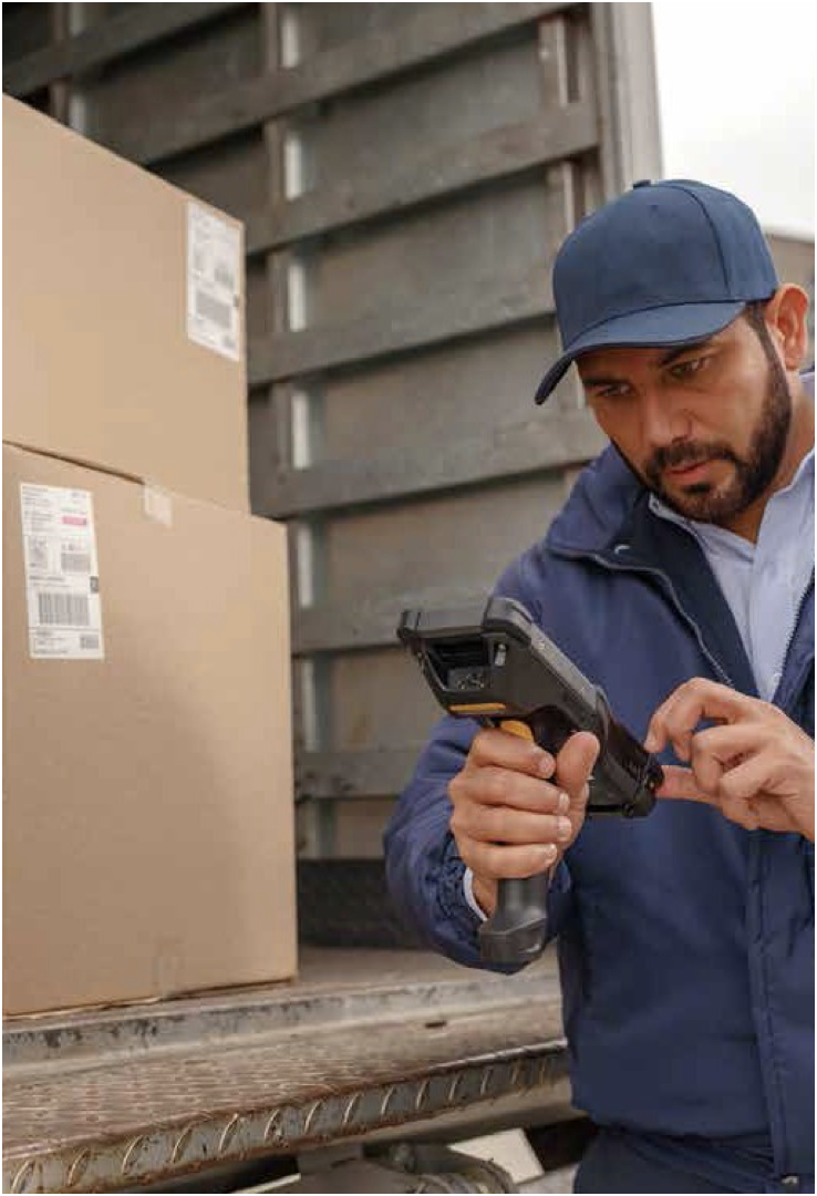 Worker scanning packages in a truck
